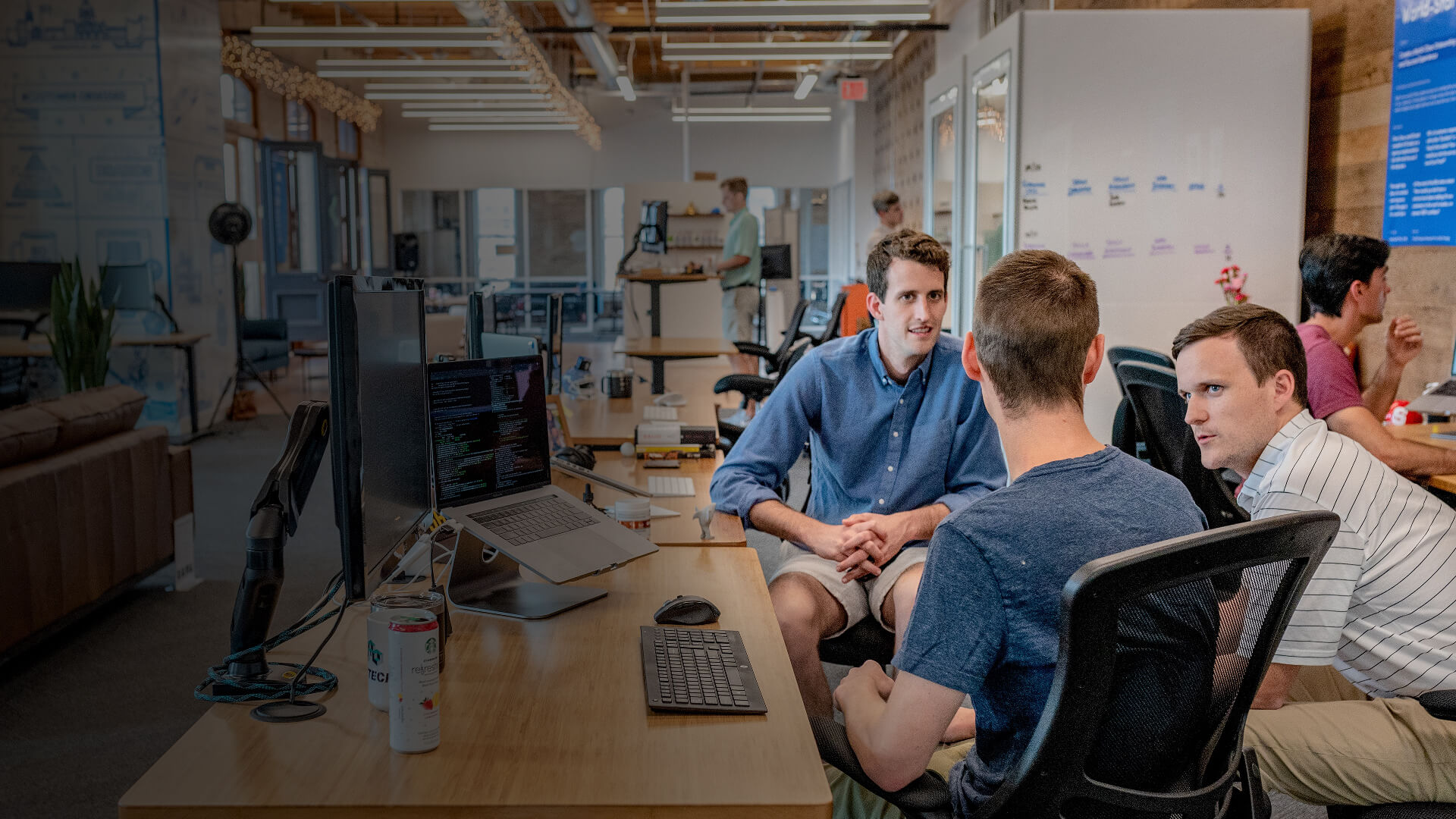 Software engineers discussing cloud computing