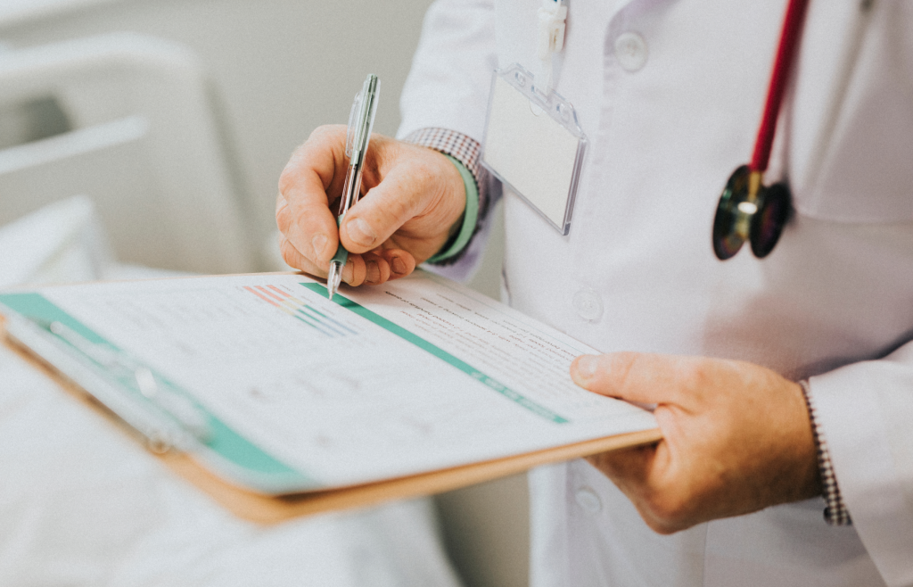 Healthcare Integrations: 4 Most Effective Practices and Cutting-Edge Tech Solutions 1 A doctor entering patient data