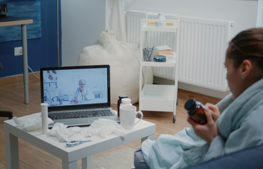 Healthcare Integrations: 4 Most Effective Practices and Cutting-Edge Tech Solutions 4 A patient having a video call with her doctor