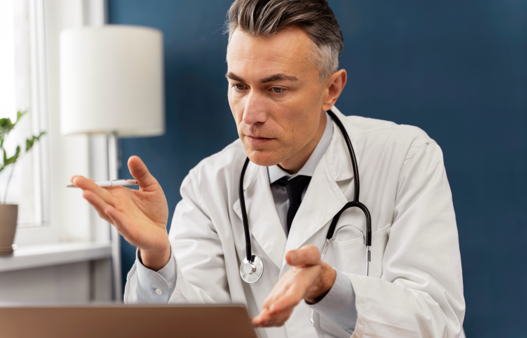 A doctor having a telehealth consultation with his patient