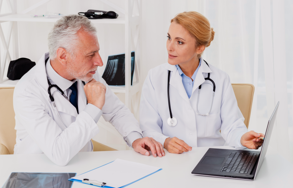 Doctors discussing patients' health records