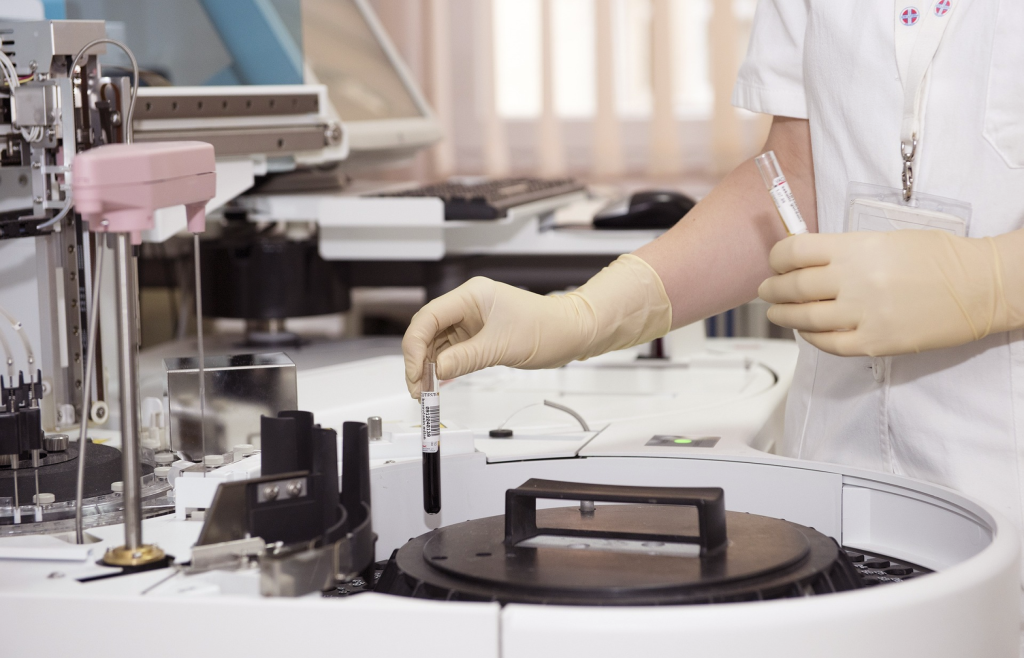 A physician performing blood analysis