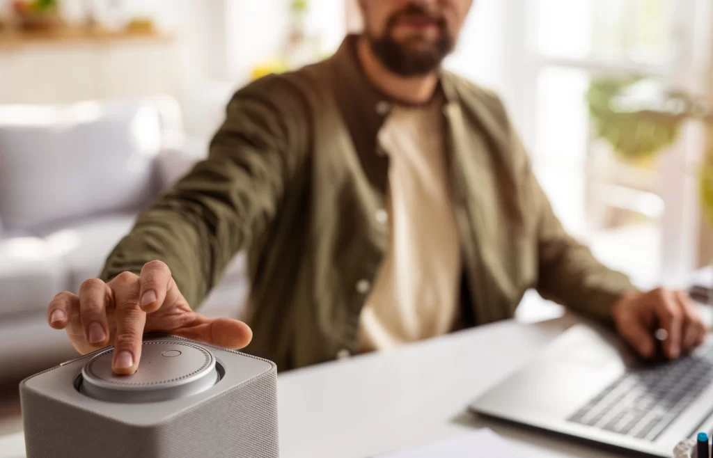 Men is working with AI voice assistant