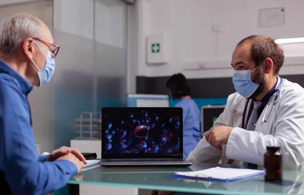 Top 6 FHIR Server Options: A Comprehensive Comparison for Your Healthcare Needs 1 A doctor discusses the patient's health state